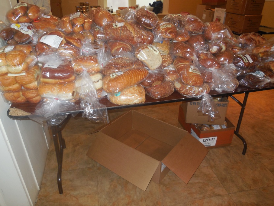 Bags of donated bread are available on the donation table for the homeless people to take with them after their lunch. (Photo by: Laura Nielsen)
